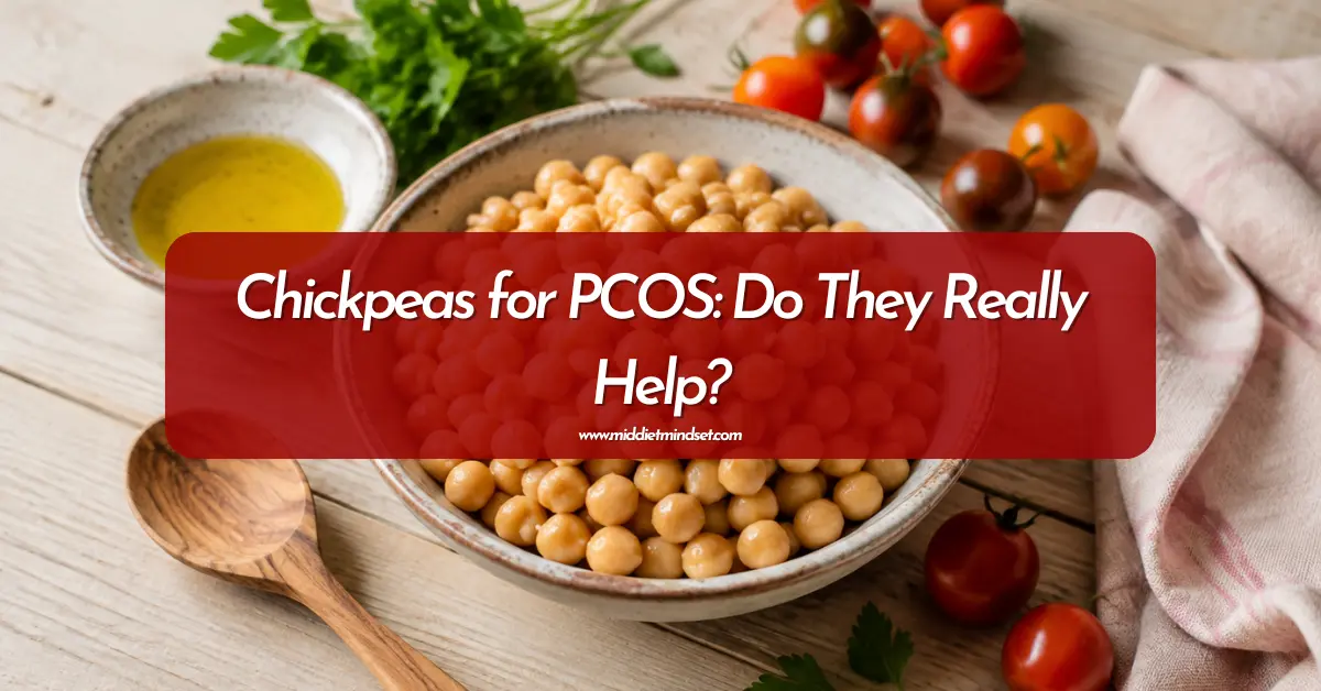 Bowl of chickpeas with olive oil, tomatoes, and parsley for an article about chickpeas for PCOS