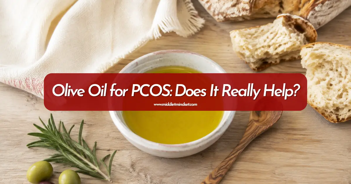 Bowl of olive oil with bread, olives, and rosemary for an article about olive oil for PCOS